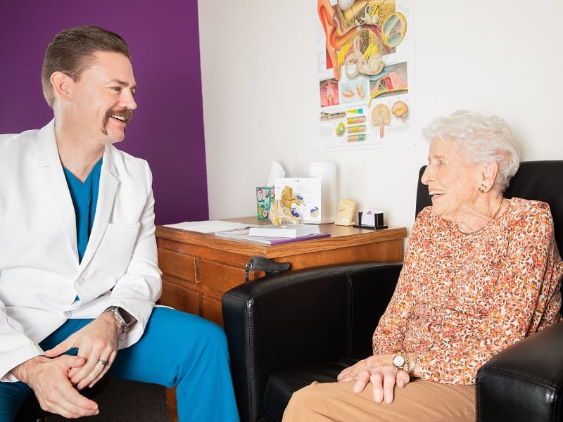 Audiologist Dan giving a hearing consultation to a patient
